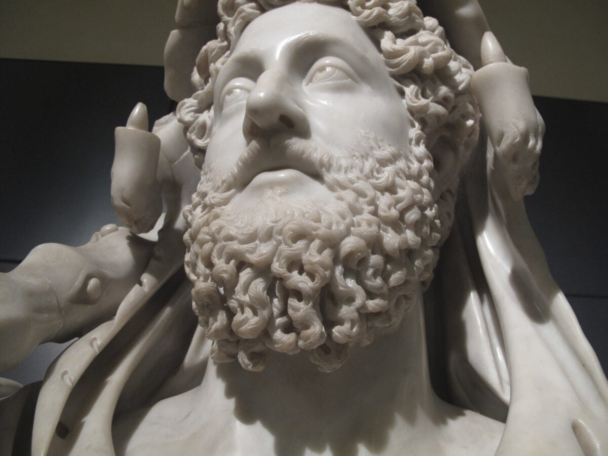 Bust of Commodus as Hercules This official bust of Emperor Commodus showed him in the guise of Hercules. This close up view allows you to see the intricate drilling of the details in the beard, typical of Antonine portraiture. The incised pupils looking up are supposed to give Commodus the air of a thinking man, a philosopher. by R Rumora (2012) copyright: 2012 R Rumora (used with permission) photographed place: Roma (Rome)
