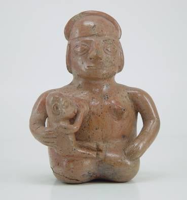 Moche ceramic vessel showing a woman breastfeeding. Larco Museum Collection. Lima-Peru
