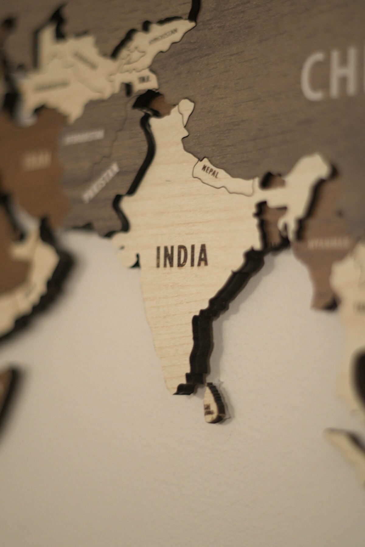 A wooden layered map of Central Asia, mainly India